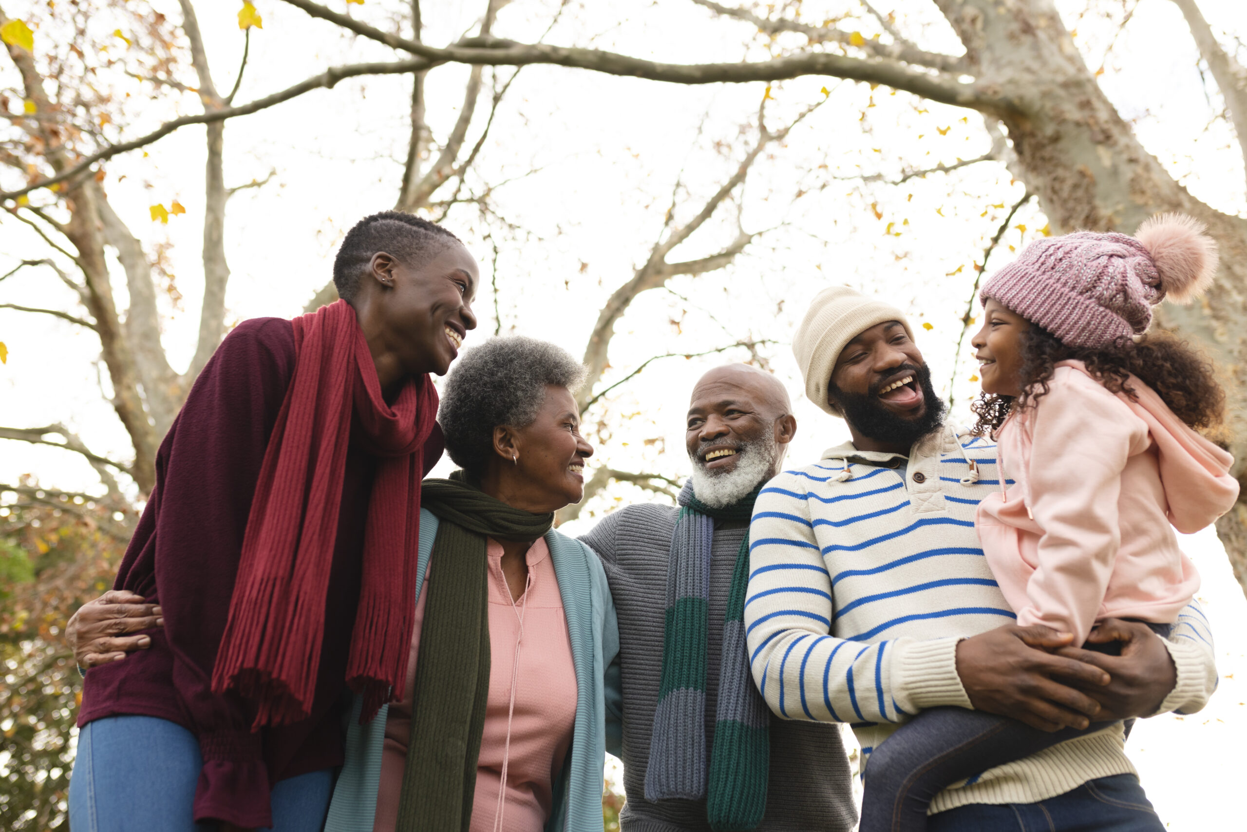 Image of happy african american multi generation family in autumn garden