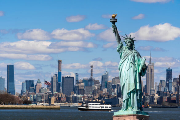 The Statue of Liberty over the Scene of New york cityscape river side which location is lower manhattan